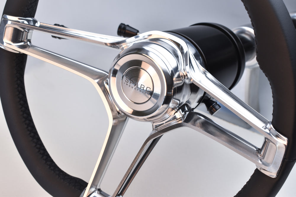 Detail of Redemption in machine finish with black leather wrap